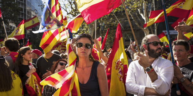 BARCELONA, SPAIN - OCTOBER 29: Spanish government supporters wave Spanish flags and carry banners during a large pro-unity demonstration on October 29, 2017 in Barcelona, Spain. Thousands gather in Barcelona, two days after the Catalan Parliament voted to split from Spain. The Spanish government has responded by imposing direct rule and dissolving the Catalan parliament. on October 29, 2017 in Barcelona, Spain. on October 29, 2017 in Barcelona, Spain. (Photo by Etienne De Malglaive/Getty Image