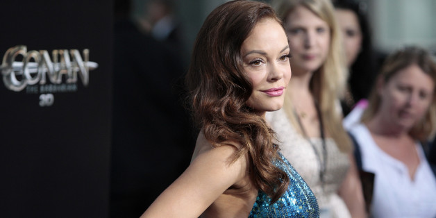 Cast member Rose McGowan arrives at the film premiere of "Conan the Barbarian" in Los Angeles, California, August 11, 2011. REUTERS/Jason Redmond (UNITED STATES - Tags: ENTERTAINMENT)