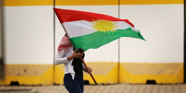 An Iraqi Kurd marches with a Kurdish flag during a protest in support of the Iraqi Kurdish leader, in Arbil, the capital of autonomous Iraqi Kurdistan, on October 30, 2017.
Long-time Kurdish leader Massud Barzani, the architect of the referendum, announced on October 29, 2017 he is stepping down after it led to Iraq's recapture of almost all disputed territories that had been under Kurdish control. / AFP PHOTO / SAFIN HAMED (Photo credit should read SAFIN HAMED/AFP/Getty Images)
