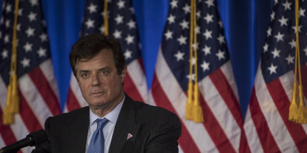 FILE: Paul Manafort, a Trump campaign worker, stands on stage before Donald Trump, presumptive Republican presidential candidate, speaks during a primary night event at the Trump National Golf Club Westchester in Briarcliff Manor, New York, U.S., on Tuesday, June 7, 2016. Manafort, a former campaign manager for President Donald Trump, and his onetime business partner Rick Gates were charged with conspiracy against the U.S., the first people charged in the broad investigation into Russian meddlin