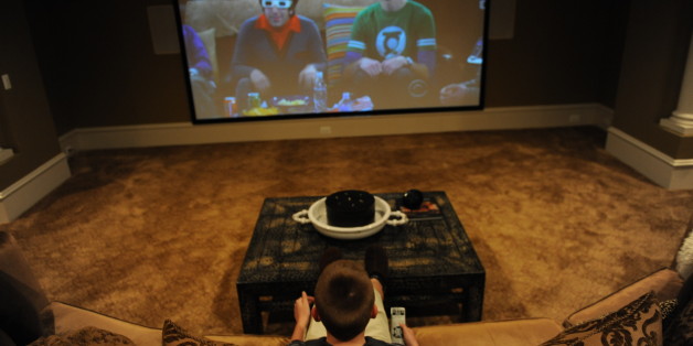 LEESBURG, VA - MARCH 25: Cole Pendergrast watches TV in the family's basement theater room at the family home on March 25, 2010, in Leesburg, VA. The Pendergrast family is one of several families to be recently filmed for MTV's 'Teen Cribs' -- the popular wish-fufillment show where wealthy teens show off their palatial homes. (Photo by Jahi Chikwendiu/The Washington Post via Getty Images)