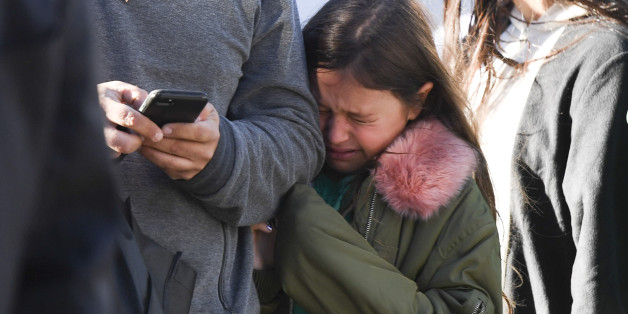 A young girl reacts as police officers secure an area following a shooting incident in New York on October 31, 2017.
Several people were killed and numerous others injured in New York on Tuesday after a vehicle plowed into a pedestrian and bike path in Lower Manhattan, police said. 'The vehicle struck multiple people on the path,' police tweeted. 'The vehicle continued south striking another vehicle. The suspect exited the vehicle displaying imitation firearms & was shot by NYPD.'
/ AFP PHOTO / Don EMMERT (Photo credit should read DON EMMERT/AFP/Getty Images)