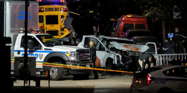 Police investigate a pickup truck used in an attack on the West Side Highway in Manhattan, New York, U.S., November 1, 2017. REUTERS/Andrew Kelly