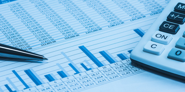 Accounting financial papers analysis charts with calculator, paper and pen in blue
