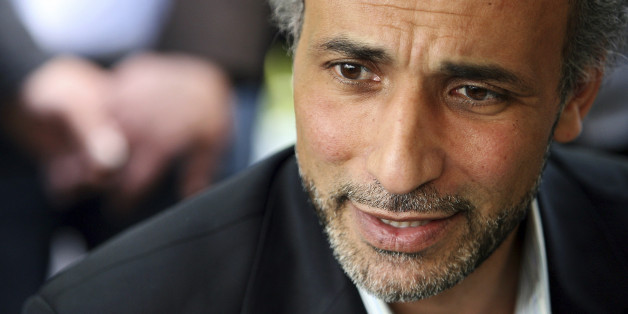 Author Tariq Ramadan talks with a journalist after a conference at the Er-Rahma mosque in Nantes, western France, April 25, 2010. Ramadan, a Swiss citizen of Egyptian origin who was born in Switzerland, has written extensively on Western Muslims and on Islam. He is president of the thinktank European Muslim Network in Brussels and teaches at Britain's Oxford University. REUTERS/Stephane Mahe (FRANCE - Tags: RELIGION PROFILE)