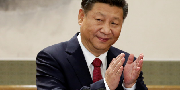 China's President Xi Jinping claps after his speech as he and other new Politburo Standing Committee members meet with the press at the Great Hall of the People in Beijing, China October 25, 2017. REUTERS/Jason Lee