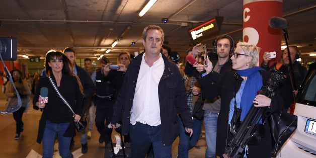 Catalan dismissed Interior chief Joaquim Forn (C) is followed by journalists upon his arrival at El Prat airport in Barcelona after flying from Brussel on October 31, 2017.Spain's top criminal court today summoned Catalonia's axed separatist leader for questioning, hours after he appeared in Brussels insisting he remained the 'legitimate president' of a region now under direct rule from Madrid. The National Audience in Madrid, which deals with major criminal cases, summoned Carles Puigdemont and
