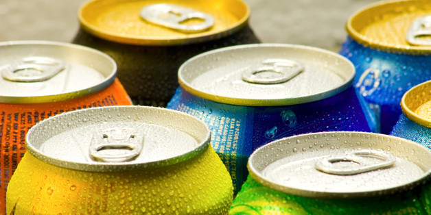 Cans of soft drink. Cooling frozen and with water drops