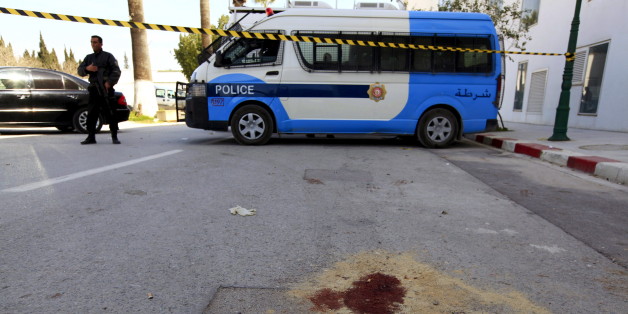 A policeman stands past blood stains, inside the compound of the national Bardo museum in Tunis March 19, 2015. Tunisia said it would deploy the army to major cities and arrested four people on Thursday after militant gunmen killed 20 foreign tourists visiting the national Bardo museum, the worst attack on the north African country in more than a decade. REUTERS/Anis Mili