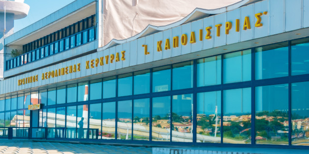 CORFU, GREECE - JUNE 30, 2011: Modern building of Kerkyra airport and tourists