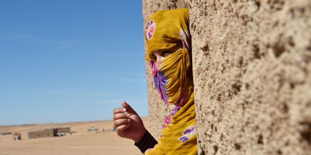 Sahrawi refugee Selembouha Dadi stands at her house at the Boujdour camp for Sahrawi refugees on the outskirts of Tindouf, south west of Algeria, on October 20, 2017. / AFP PHOTO / RYAD KRAMDI (Photo credit should read RYAD KRAMDI/AFP/Getty Images)