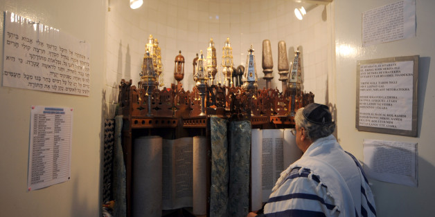 A Tunisian Jew prays at the Synagogue in La Goulette on the outskirts of Tunis on February 1, 2011 in Tunis. Arsonists set fire to a synagogue in the southern Gabes region of Tunisia, a leader of the local Jewish community said. AFP PHOTO/FETHI BELAID (Photo credit should read FETHI BELAID/AFP/Getty Images)