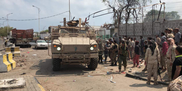 Yemeni men and security forces inspect the site of a suicide bombing in the southern port city of Aden, on November 5, 2017.Al-Qaeda suspects carried out twin suicide bombings and took hostages, officials said, as they struck at the heart of the Yemeni government after suffering a string of setbacks. The apparently coordinated attacks spell an abrupt end to a period of relative calm that has reigned in Aden, where the government of President Abedrabbo Mansour Hadi has been based since it was dri