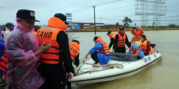 This picture taken on November 5, 2017 shows a police boat transporting local residents to a safer place from a flooded area in the central province of Quang Nam following the passage of the typhoon Damrey on central Vietnam.
At least 49 people have died and at least 19 missing after Typhoon Damrey slammed into central Vietnam, disaster officials said with several areas totally submerged in the worst flooding in years. / AFP PHOTO / Vietnam News Agency / STR (Photo credit should read STR/AFP/Getty Images)