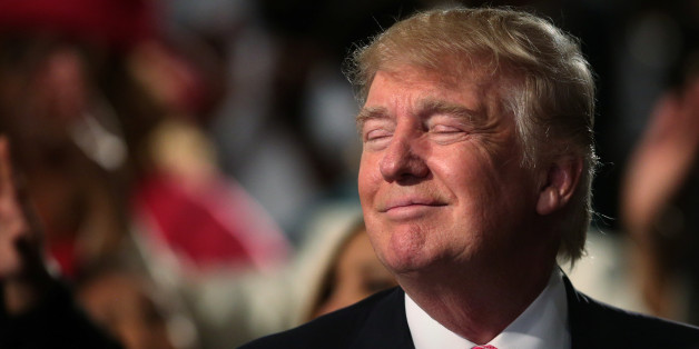 Republican presidential nominee Donald Trump closes his eyes as he listens to the music as he attends a church service in Detroit, Michigan, U.S., September 3 2016. REUTERS/Carlo Allegri