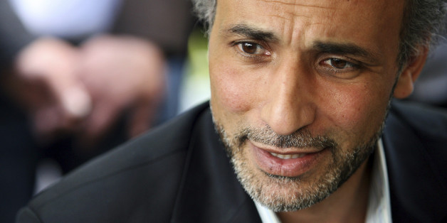 Author Tariq Ramadan talks with a journalist after a conference at the Er-Rahma mosque in Nantes, western France, April 25, 2010. Ramadan, a Swiss citizen of Egyptian origin who was born in Switzerland, has written extensively on Western Muslims and on Islam. He is president of the thinktank European Muslim Network in Brussels and teaches at Britain's Oxford University. REUTERS/Stephane Mahe (FRANCE - Tags: RELIGION PROFILE)