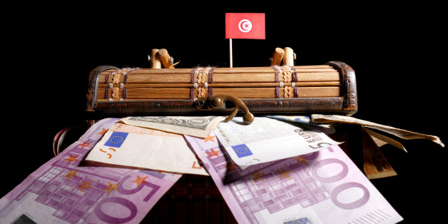 Tunisian flag on top of crate full of money