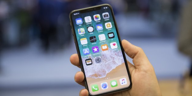 TORONTO, ON. November 3, 2017 - Creative Kelly McLaughlin shows off the iPhone X at the Apple store in the Toronto Eaton Centre. (Anne-Marie Jackson/Toronto Star via Getty Images)