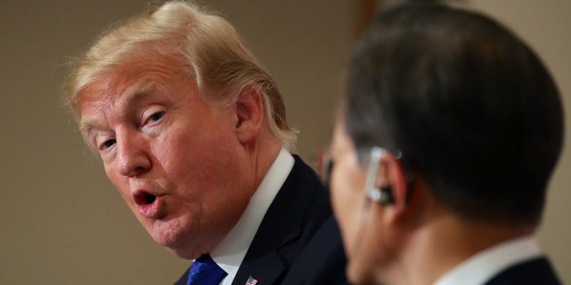 U.S. President Donald Trump, left, looks at Moon Jae-in, South Korea's president, as he speaks during a news conference at the presidential Blue House in Seoul, South Korea, on Tuesday, Nov. 7, 2017. Trump said that North Korea should come to the table and make a deal on its missile and nuclear programs. Photographer: SeongJoon Cho/Bloomberg via Getty Images