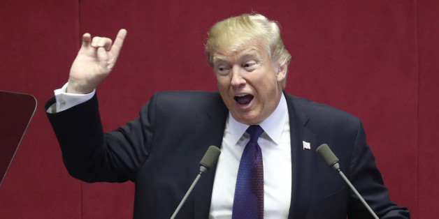 US President Donald Trump (C) addresses the National Assembly in Seoul on November 8, 2017.Trump's marathon Asia tour moves to South Korea, another key ally in the struggle with nuclear-armed North Korea, but one with deep reservations about the US president's strategy for dealing with the crisis. / AFP PHOTO / Lee Jin-man (Photo credit should read LEE JIN-MAN/AFP/Getty Images)