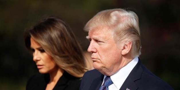 US President Donald Trump(R) and First Lady Melania pay a silent tribute at the National Cemetery in Seoul on November 8, 2017.Trump offered North Korean leader Kim Jong-Un what he called 'a path towards a much better future' as tensions soar over Pyongyang's nuclear ambitions. / AFP PHOTO / POOL / KIM Hong-Ji (Photo credit should read KIM HONG-JI/AFP/Getty Images)