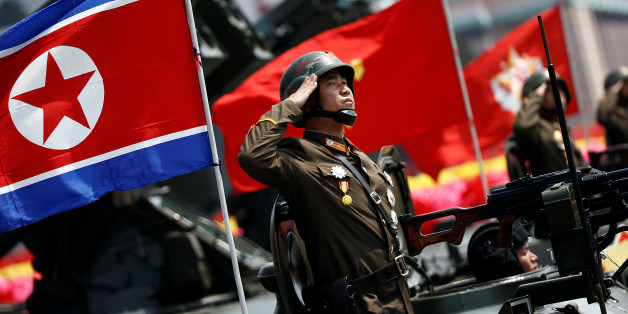 A soldier salutes from atop an armoured vehicle as it drives past the stand with North Korean leader Kim Jong Un during a military parade marking the 105th birth anniversary of country's founding father Kim Il Sung, in Pyongyang April 15, 2017. REUTERS/Damir Sagolj