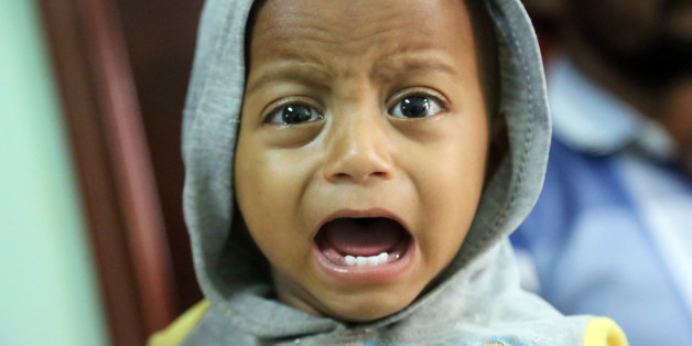 A Yemeni child, who is suspected of being infected with cholera, cries at a hospital in the Yemeni coastal city of Hodeidah on November 5, 2017.Humanitarian responders have this year provided direct aid to more than seven million Yemenis living on the brink of famine, according to the UN Office for the Coordination of Humanitarian Affairs. / AFP PHOTO / ABDO HYDER (Photo credit should read ABDO HYDER/AFP/Getty Images)