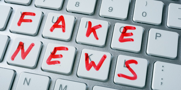 Words fake news written on a keyboard.
