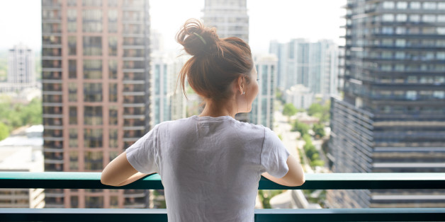A young woman standing on a balcony in the cityhttp://195.154.178.81/DATA/i_collage/pu/shoots/805445.jpg