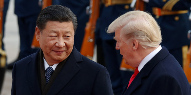 U.S. President Donald Trump takes part in a welcoming ceremony with China's President Xi Jinping at the Great Hall of the People in Beijing, China, November 9, 2017. REUTERS/Damir Sagolj