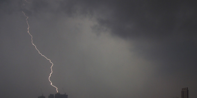 MUMBAI, INDIA - OCTOBER 6: Lighting at Mumbai sky line with sudden heavy rain, on October 6, 2017 in Mumbai, India. Heavy rain accompanied by thunderstorms and lightning lashed south and central parts of Mumbai. The sudden downpour took the city by surprise, given that it had been witnessing a prolonged period of clear skies and heat. (Photo by Vijayanand Gupta/Hindustan Times via Getty Images)