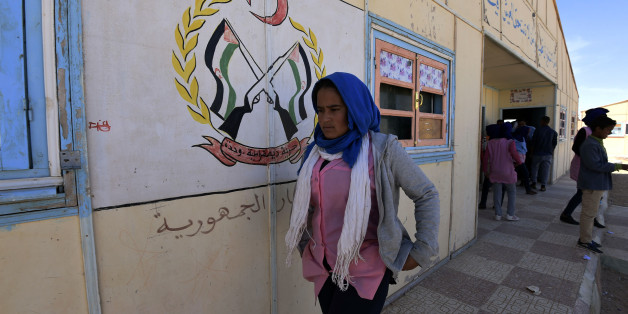 Children leave the classroom of a school at the Smara refugee camp in Algeria's Tindouf province on February 25, 2016.The Western Sahara is a territory bordered by Morocco and Algeria and disputed by Spain and Morocco who both claiming sovereignty. / AFP / Farouk Batiche (Photo credit should read FAROUK BATICHE/AFP/Getty Images)