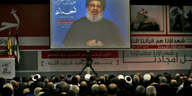 A picture taken on November 10, 2017, shows Hassan Nasrallah, the head of Lebanon's militant Shiite movement Hezbollah, giving a televised address during a gathering in Beirut's southern suburb.Nasrallah said Saad Hariri, who resigned as Lebanese prime minister from Riyadh last week, was 'detained' by Saudi Arabia. / AFP PHOTO / ANWAR AMRO (Photo credit should read ANWAR AMRO/AFP/Getty Images)