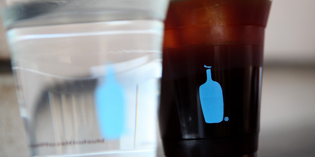 SAN FRANCISCO, CA - SEPTEMBER 15: The Blue Bottle Coffee logo is displayed on a cup of Blue Bottle coffee on September 15, 2017 in San Francisco, California. Nestle announced its plans to acquire a 68% stake in Blue Bottle Coffee in a deal estimated at $700 million. (Photo by Justin Sullivan/Getty Images)