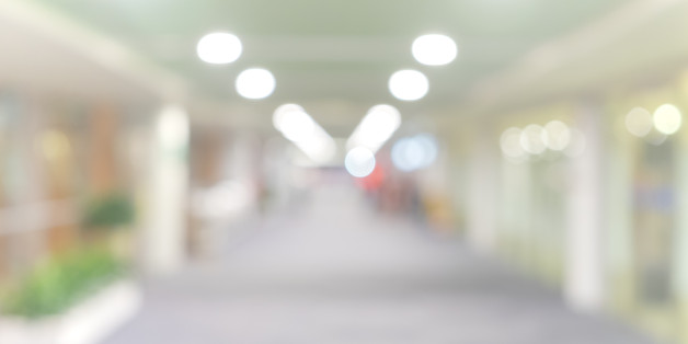 blur walkway in the building at night for abstract background.