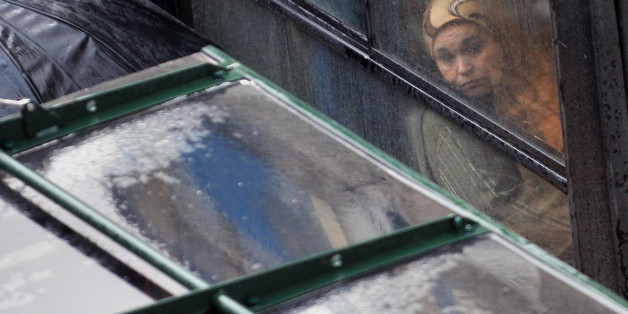 An Algerian woman watches the rain falls through the bus window at a main street in Algiers, on March 8, 2010. On the International Women's Day the United Nation estimates women's literacy in the conservative Muslim country at around 40 percent. AFP PHOTO / FAYEZ NURELDINE (Photo credit should read FAYEZ NURELDINE/AFP/Getty Images)