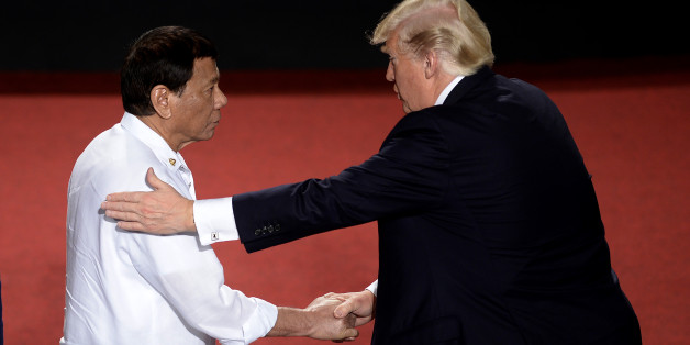 TOPSHOT - Philippine President Rodrigo Duterte shakes hands with US President Donald Trump (R) during the 31st Association of Southeast Asian Nations (ASEAN) Summit in Cultural Center of the Philippines (CCP) in Manila on November 13, 2017.
World leaders are in the Philippines' capital for two days of summits. / AFP PHOTO / AFP PHOTO AND POOL / NOEL CELIS (Photo credit should read NOEL CELIS/AFP/Getty Images)