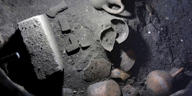 Various decorative rocks and pottery pieces are seen at a water cistern in a residential area in the pre-Hispanic ruins of Zultepec-Tocoaque is located roughly 80 kilometres (50 miles) northeast of Mexico City, Mexico November 18, 2015. Archaeologists in Mexico have discovered the remains of what they've concluded are those of a high-ranking figure in the pre-Hispanic ruins of Zultepec-Tocoaque, a finding officials believe could shed new light on ancient Aztec culture.The skeletal remains were found at a water cistern in a residential area of the ancient Aztec town that was reportedly once home to approximately 5,000 people, mostly priests and farmers. REUTERS/Henry Romero