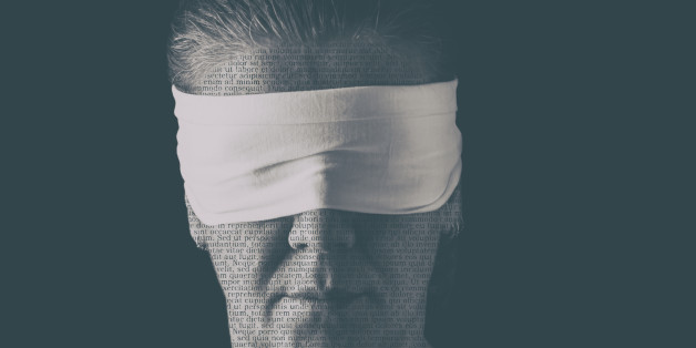 Blindfolded woman close up patterned with no-sense words. Concept of censorship, freedom of speech, freedom of press.