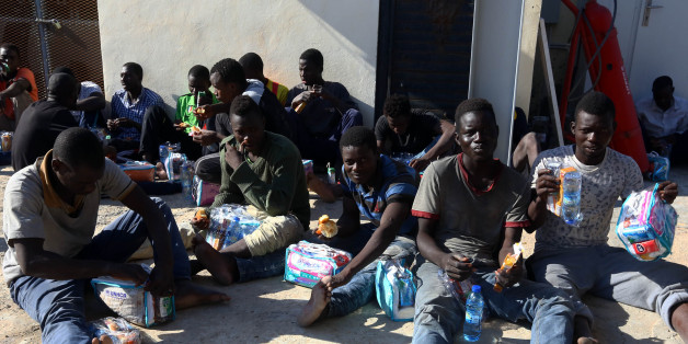 African migrants arrive at a naval base in the Libyan capital Tripoli on October 17, 2017, after they were rescued from a rubber boat by coastguards off the Libyan coast. / AFP PHOTO / MAHMUD TURKIA (Photo credit should read MAHMUD TURKIA/AFP/Getty Images)