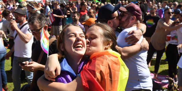 Supporters of the same-sex marriage 'Yes' vote gather to celebrate the announcement in a Sydney park on November 15, 2017.Australians voted in favour of allowing same-sex couples to marry, official results showed on November 15, sending the task of legalising marriage equality to a deeply divided parliament. / AFP PHOTO / WILLIAM WEST (Photo credit should read WILLIAM WEST/AFP/Getty Images)