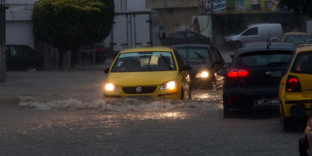 TUNIS, TUNISIA - JUNE 06: Vehicles pass trough the puddles in a street as it rains in Tunis, Tunisia on June 06, 2017. (Photo by Amine Landoulsi/Anadolu Agency/Getty Images)
