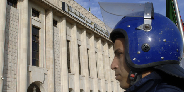 An Algerian policeman stands guard outside the People's National Assembly bulding in the capital Algiers on November 27, 2016. / AFP / RYAD KRAMDI (Photo credit should read RYAD KRAMDI/AFP/Getty Images)