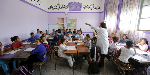Schoolchildren listen to a teacher as they study during a class in the Oudaya primary school in Rabat, September 15, 2015, at the start of the new school year in Morocco. Nearly three years after Taliban gunmen shot Pakistani schoolgirl Malala Yousafzai, the teenage activist last week urged world leaders gathered in New York to help millions more children go to school. World Teachers' Day falls on 5 October, a Unesco initiative highlighting the work of educators struggling to teach children amid