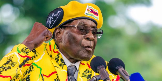Zimbabwe's President Robert Mugabe addresses party members and supporters gathered at his party headquarters to show support to Grace Mugabe becoming the party's next Vice President after the dismissal of Emerson Mnangagwa November 8 2017.Zimbabwe's sacked vice president, Emmerson Mnangagwa, said on November 8, 2017, he had fled the country, as he issued a direct challenge to long-ruling President Robert Mugabe and his wife Grace. / AFP PHOTO / Jekesai NJIKIZANA (Photo credit should read