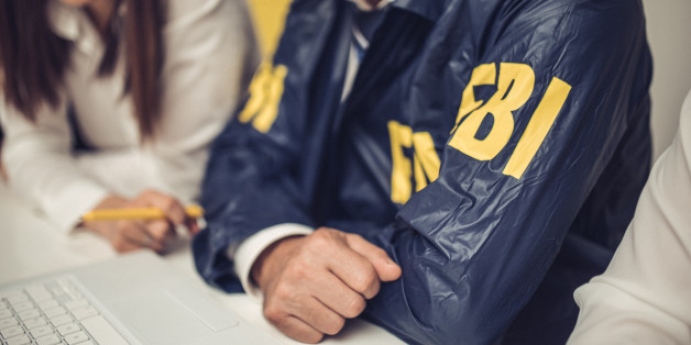 Two people, man and woman, working together in office, FBI team.