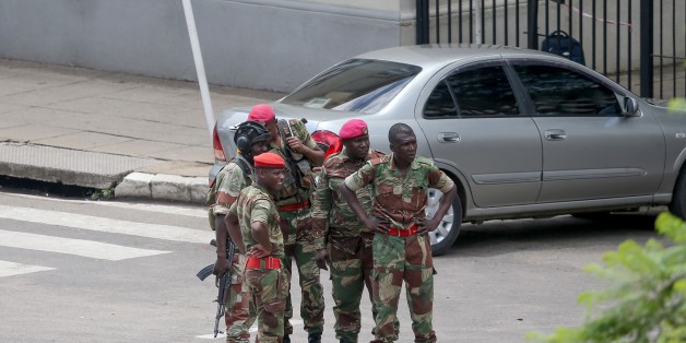 HARARE, ZIMBABWE - NOVEMBER 15 : A group of soldiers seal off a main road to the parliament building within the military activities taking place in Harare, Zimbabwe on November 15, 2017. President Robert Mugabe and his family have been detained following military intervention in capital Harare, which an army spokesman and the ruling party insisted Wednesday was not a coup. Military officers appeared on television early Wednesday to make a statement saying they were targeting criminals around President Robert Mugabe. (Photo by Tafadzwa Ufumeli/Anadolu Agency/Getty Images)