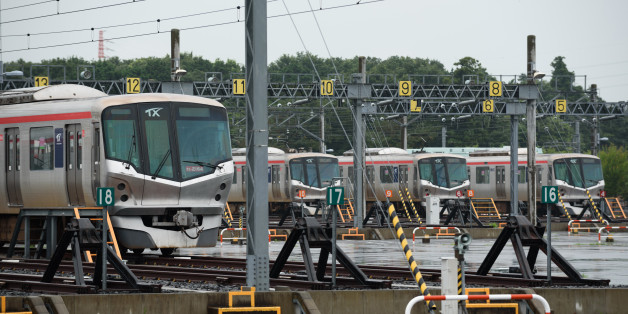 Tsukuba Express TX-1000 series trains sit parked outside the Metropolitan Intercity Railway Co. maintenance facility in Tsukubamirai, Ibaraki Prefecture, Japan, on Monday, July 6, 2015. The Tsukuba Express connects the city of Tsukuba to Akihabara in Tokyo in 45 minutes. Photographer: Akio Kon/Bloomberg via Getty Images