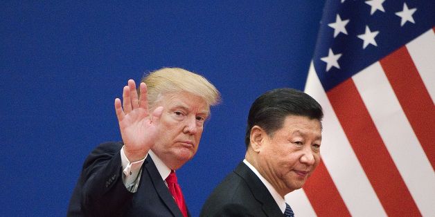 US President Donald Trump (L) and China's President Xi Jinping leave a business leaders event at the Great Hall of the People in Beijing on November 9, 2017.Donald Trump urged Chinese leader Xi Jinping to work 'hard' and act fast to help resolve the North Korean nuclear crisis, during their meeting in Beijing on November 9, warning that 'time is quickly running out'. / AFP PHOTO / Nicolas ASFOURI (Photo credit should read NICOLAS ASFOURI/AFP/Getty Images)
