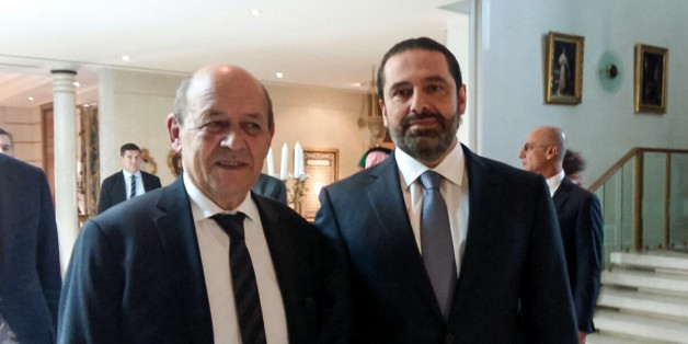A picture taken with a cell-phone on November 16, 2017, shows French Foreign Minister Jean-Yves Le Drian posing for a photo with Lebanese Prime Minister Saad Hariri in the Saudi capital Riyadh.Hariri met with Le Drian in Riyadh on November 16, the most senior Western official he has met publicly since his shock resignation announcement earlier this month.The meeting came after the French foreign minister said that Hariri had accepted an invitation to visit France for talks with President Emmanue